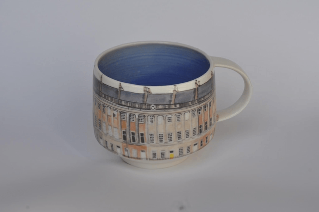 Porcelain cup with illustrated scene