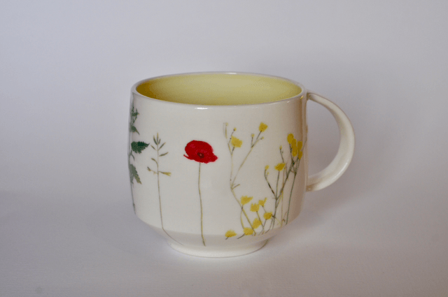 Porcelain cup with illustrated scene