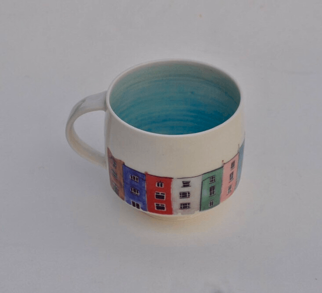 Porcelain cup with illustrated scene